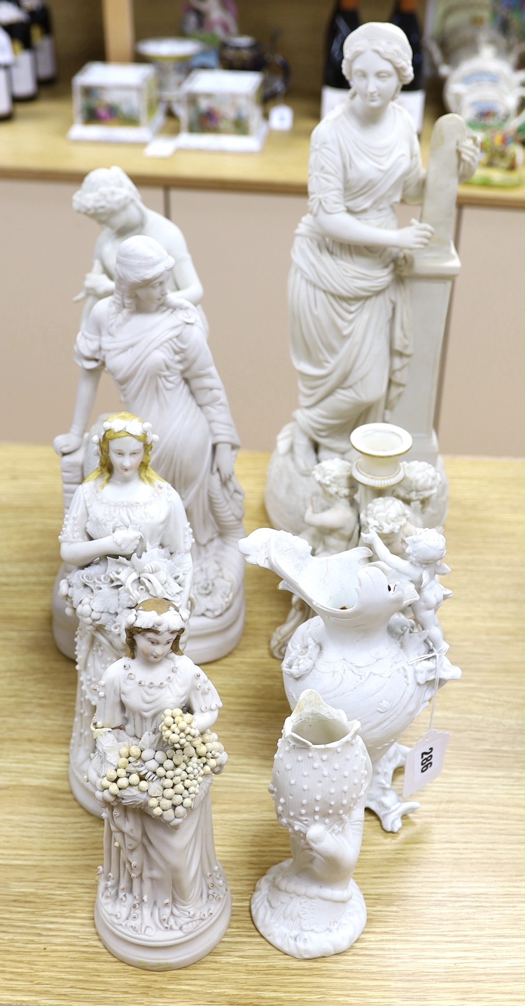 A group of Parian ware and bisque figures/ornaments. Some restoration (8) tallest 45cm